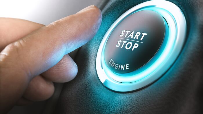 Car start button with "stop start" written on it